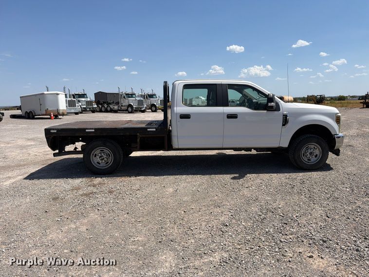 image for item EW8708 2019 Ford F250 Super Duty Crew Cab flatbed pickup truck