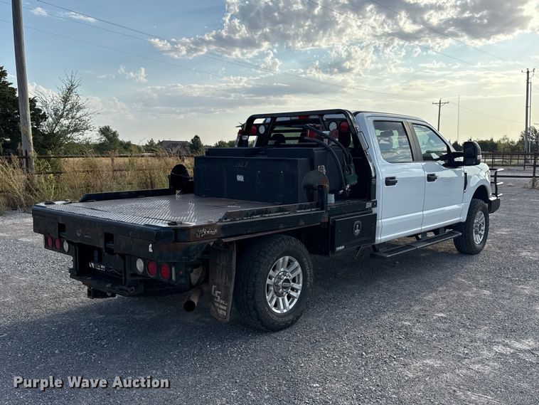 image for item EW8715 2019 Ford F250 Super Duty Crew Cab flatbed pickup truck