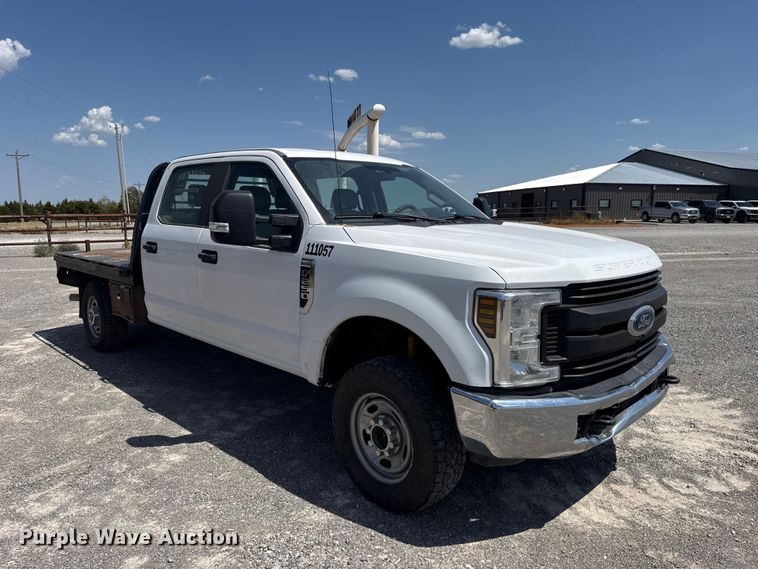 image for item EW8723 2019 Ford F250 Super Duty Crew Cab flatbed pickup truck