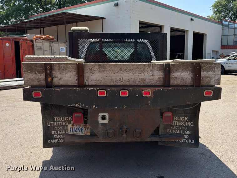 image for item FK3377 2005 Ford F350 Super Duty Crew Cab flatbed pickup truck