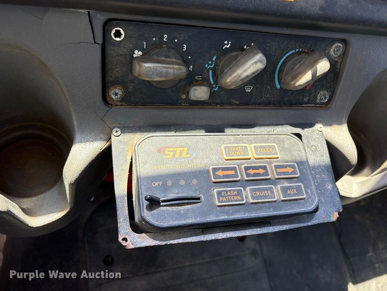image for item ES8103 2012 Freightliner Business Class M2 rollback truck