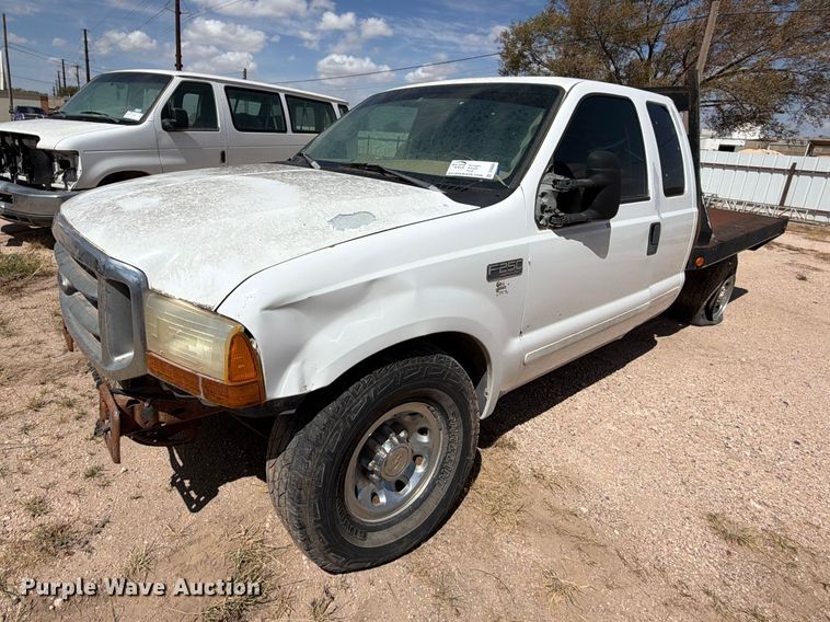 2001 Ford F250 Super Duty Ext. Cab flatbed pickup truck