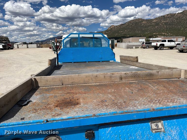 image for item ED0197 2000 International 4700 flatbed truck