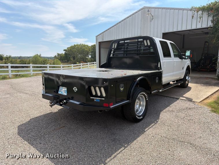 image for item EX0554 2014 Ford F350 Super Duty Crew Cab flatbed pickup truck