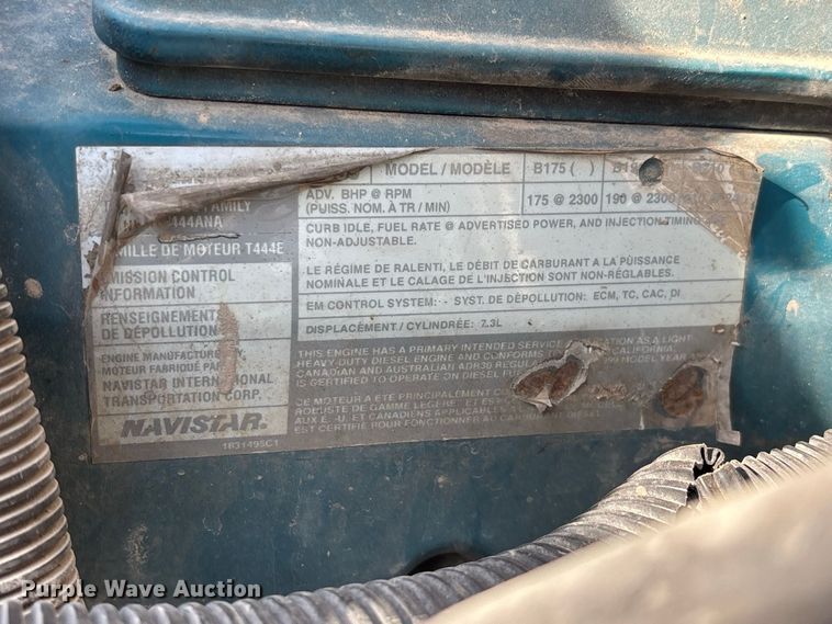 image for item FG0724 2000 International 4700 Lo-Profile flatbed truck