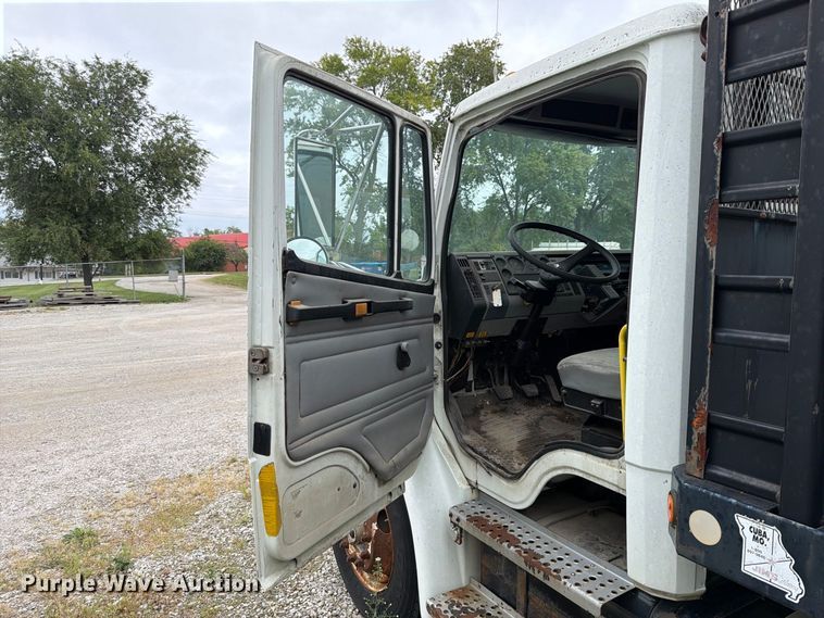 image for item FT6304 2000 Freightliner FL70 flatbed truck