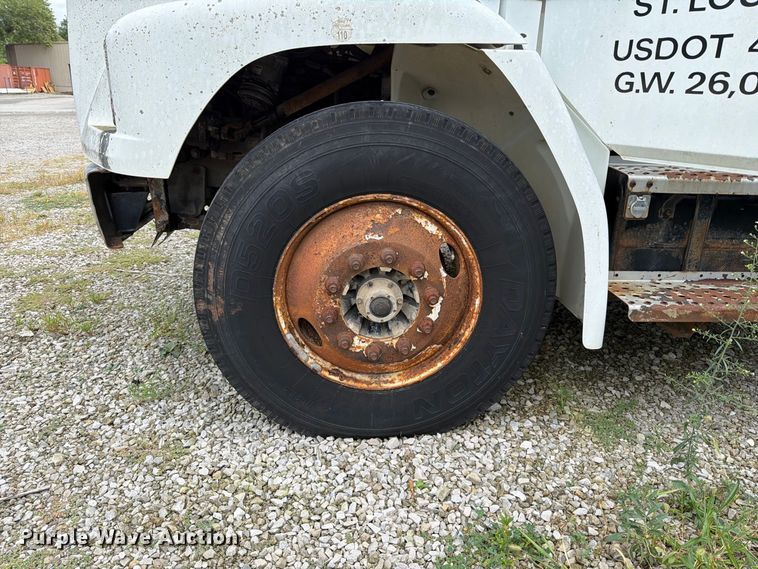 image for item FT6304 2000 Freightliner FL70 flatbed truck