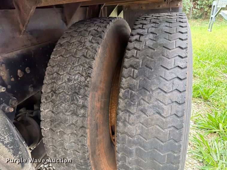 image for item FT6304 2000 Freightliner FL70 flatbed truck