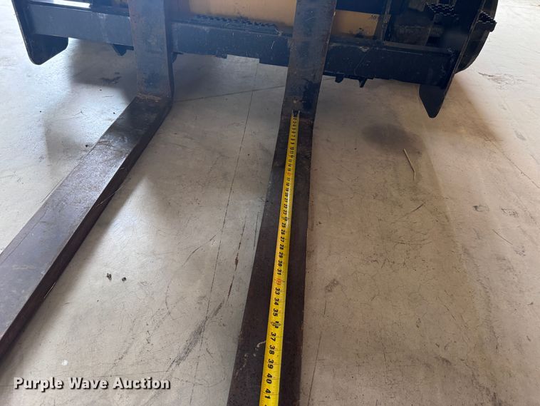 image for item EX0534 John Deere PF60 skid steer forks