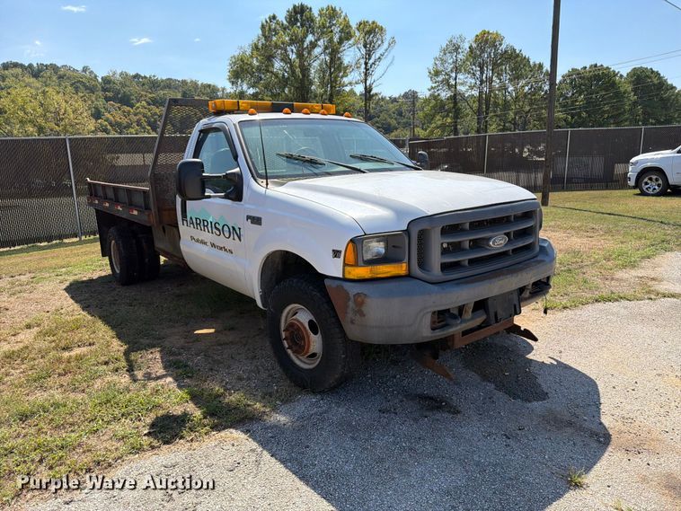 image for item EX0061 1999 Ford F350 flatbed pickup truck