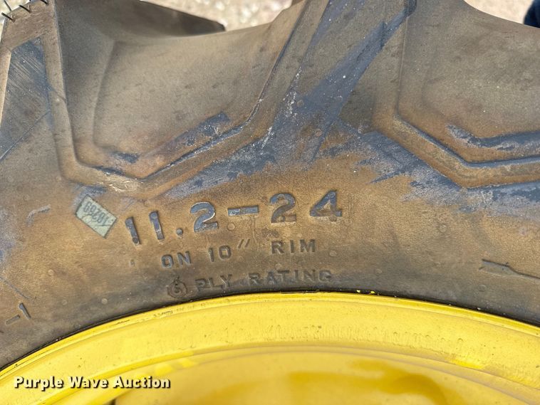 image for item EW4386 (2) 11.2-24 tires and wheels