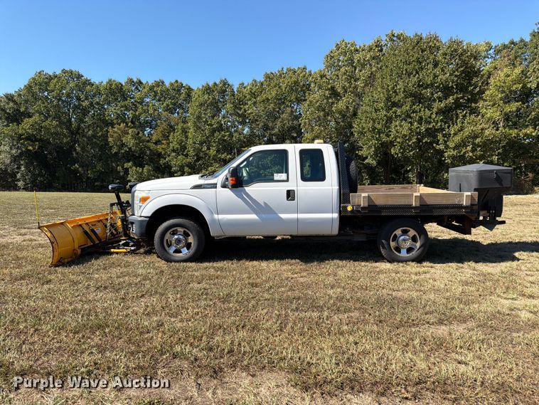 image for item DT3042 2015 Ford F250 Super Duty Ext. Cab dump flatbed pickup truck
