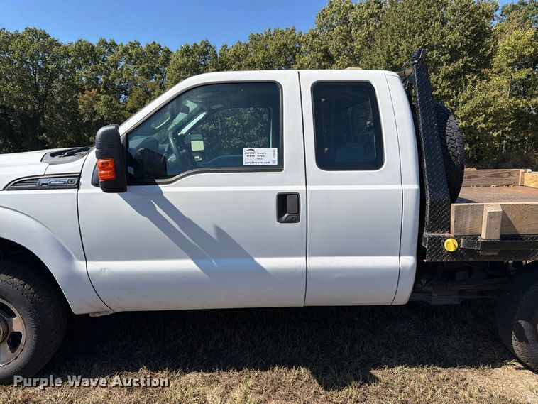 image for item DT3042 2015 Ford F250 Super Duty Ext. Cab dump flatbed pickup truck