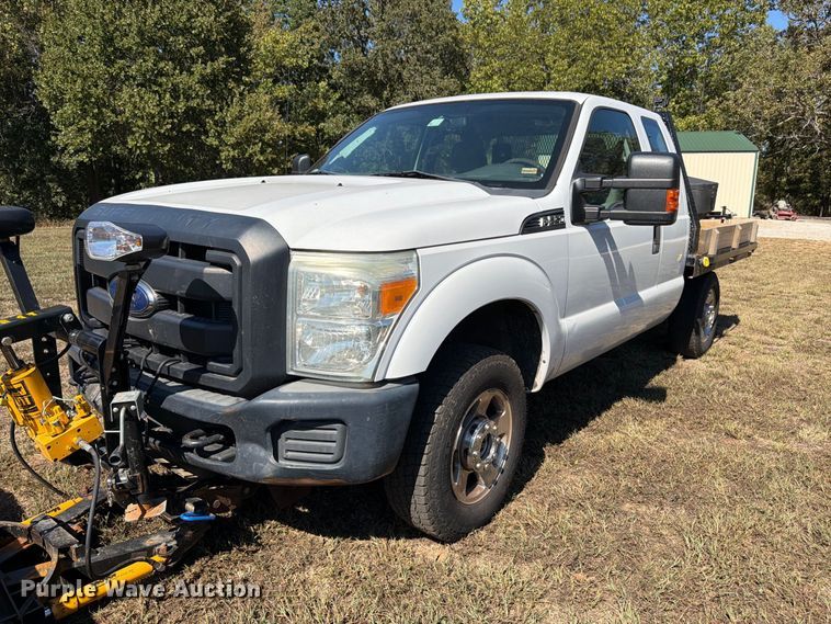 image for item DT3042 2015 Ford F250 Super Duty Ext. Cab dump flatbed pickup truck