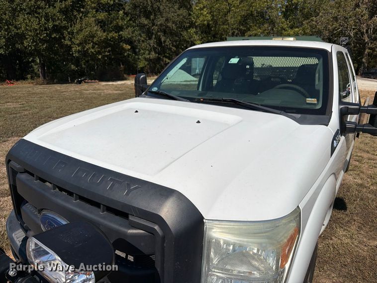 image for item DT3042 2015 Ford F250 Super Duty Ext. Cab dump flatbed pickup truck