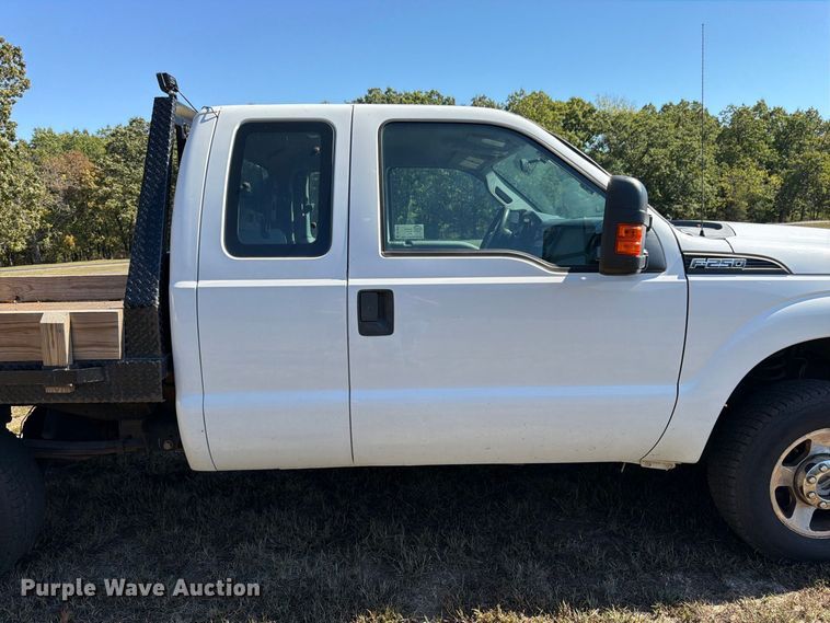 image for item DT3042 2015 Ford F250 Super Duty Ext. Cab dump flatbed pickup truck