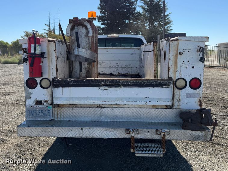 image for item EA0042 2005 Ford F350 Super Duty Crew Cab utility bed pickup truck