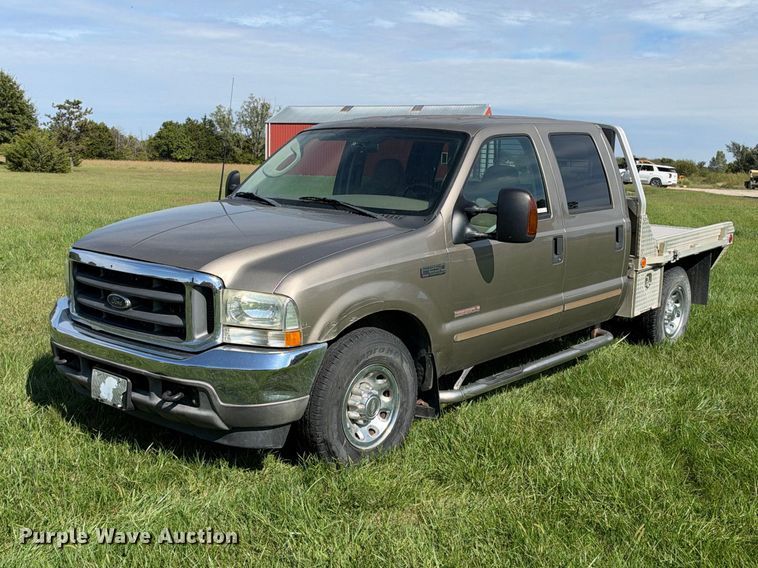 image for item EX2277 2003 Ford F250 Super Duty XLT Crew Cab flatbed pickup truck