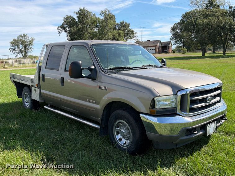 image for item EX2277 2003 Ford F250 Super Duty XLT Crew Cab flatbed pickup truck