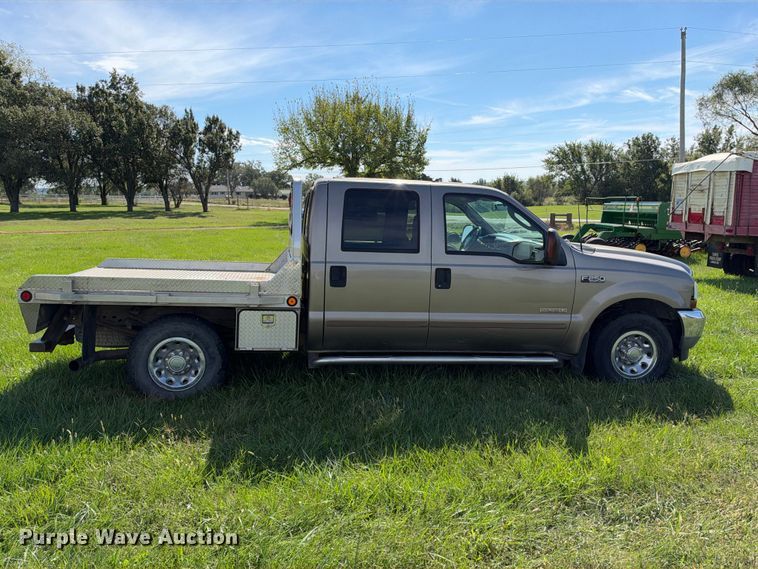 image for item EX2277 2003 Ford F250 Super Duty XLT Crew Cab flatbed pickup truck