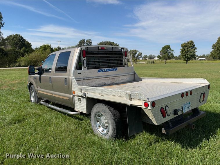 image for item EX2277 2003 Ford F250 Super Duty XLT Crew Cab flatbed pickup truck