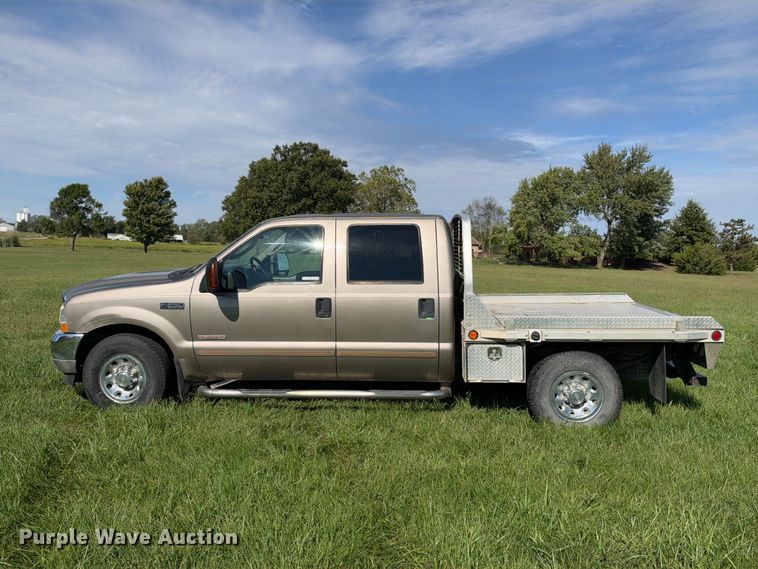 image for item EX2277 2003 Ford F250 Super Duty XLT Crew Cab flatbed pickup truck
