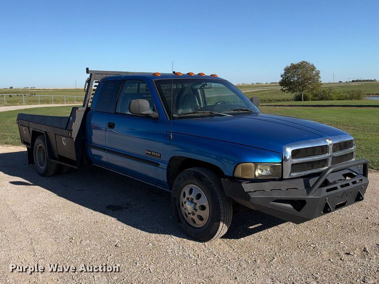 image for item EX2358 1999 Dodge Ram 3500 Ext. Cab flatbed pickup truck