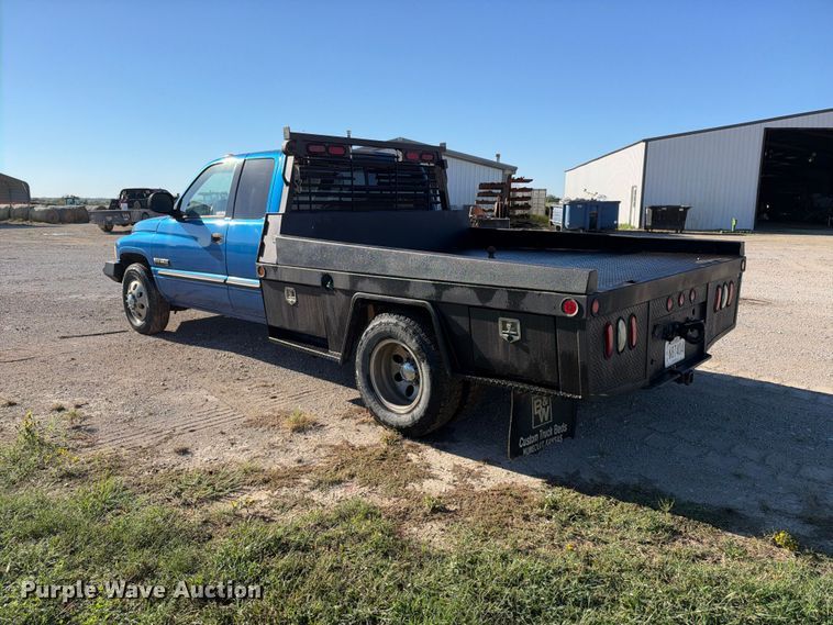 image for item EX2358 1999 Dodge Ram 3500 Ext. Cab flatbed pickup truck