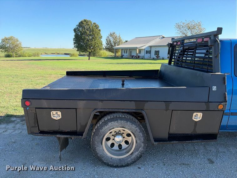 image for item EX2358 1999 Dodge Ram 3500 Ext. Cab flatbed pickup truck