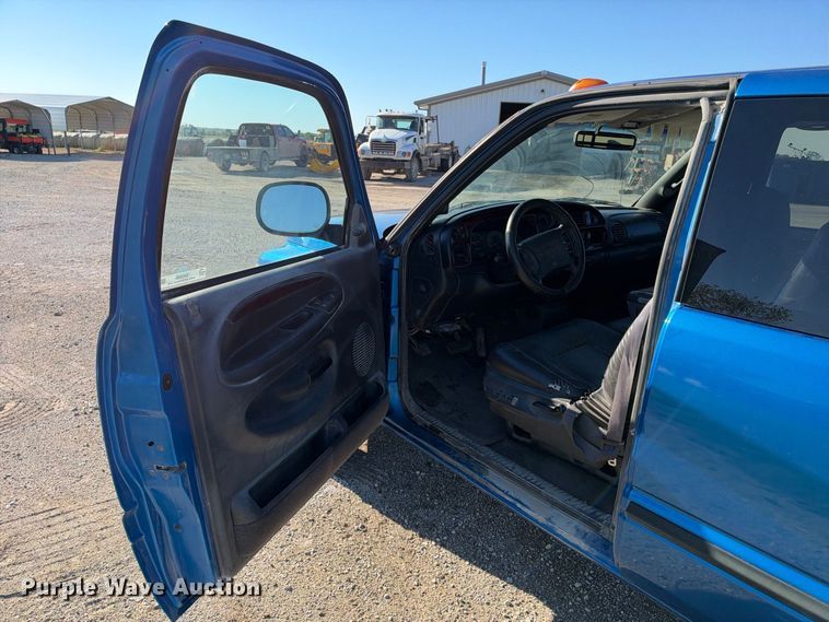 image for item EX2358 1999 Dodge Ram 3500 Ext. Cab flatbed pickup truck