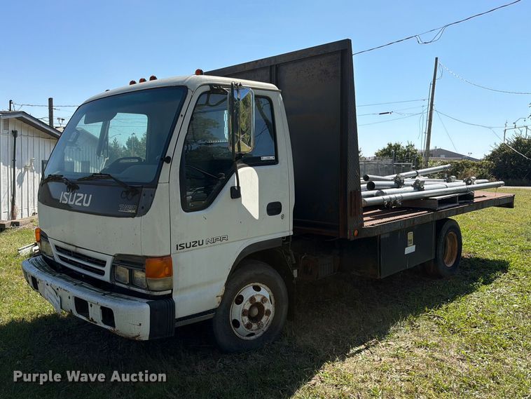 image for item FC3385 1999 Isuzu NPR flatbed truck