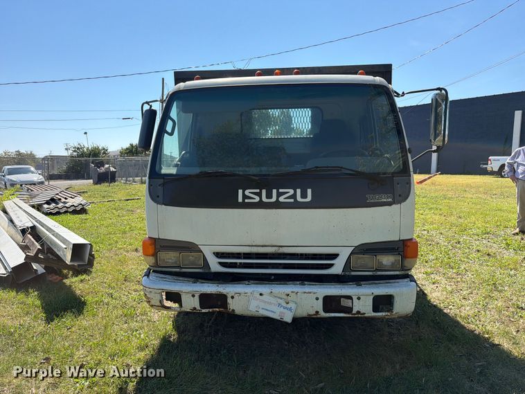 image for item FC3385 1999 Isuzu NPR flatbed truck