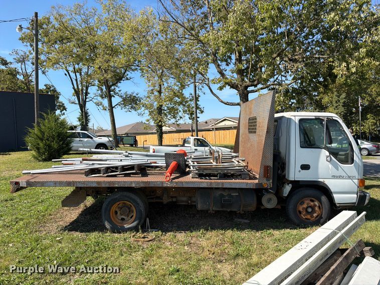 image for item FC3385 1999 Isuzu NPR flatbed truck