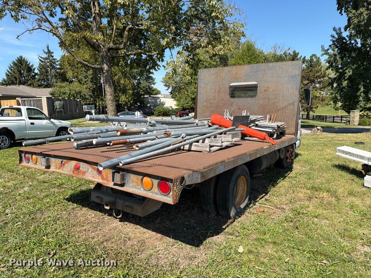 image for item FC3385 1999 Isuzu NPR flatbed truck