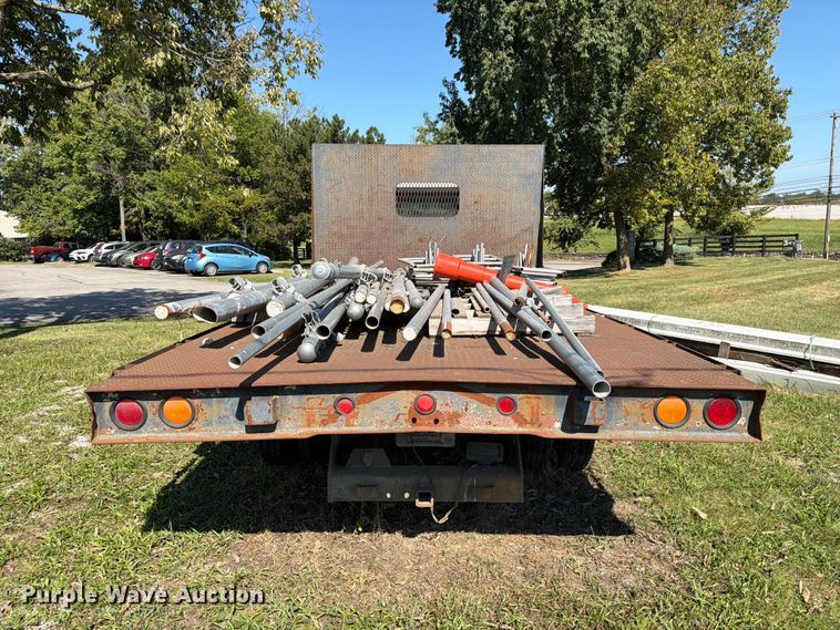 image for item FC3385 1999 Isuzu NPR flatbed truck