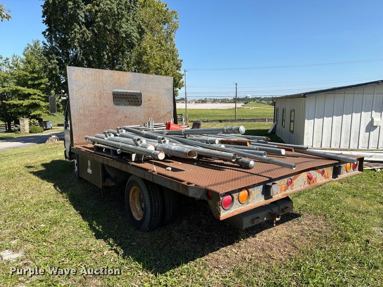 image for item FC3385 1999 Isuzu NPR flatbed truck