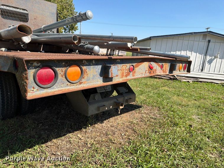 image for item FC3385 1999 Isuzu NPR flatbed truck