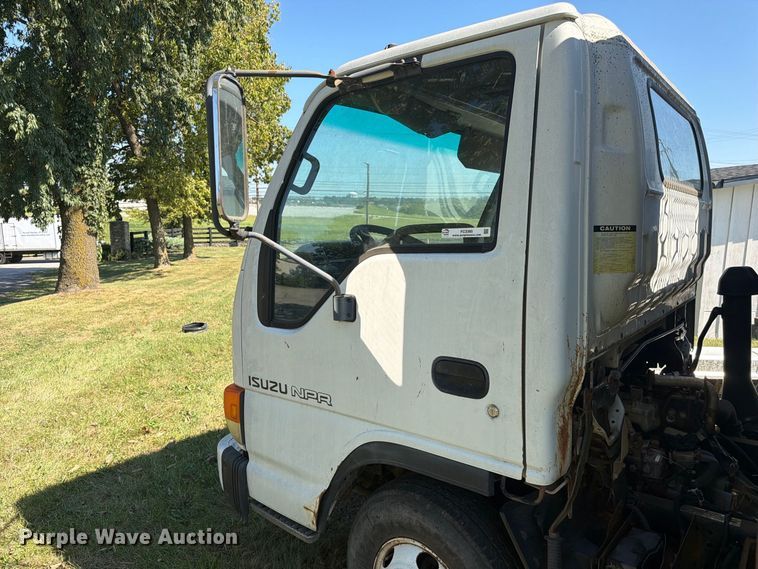 image for item FC3385 1999 Isuzu NPR flatbed truck