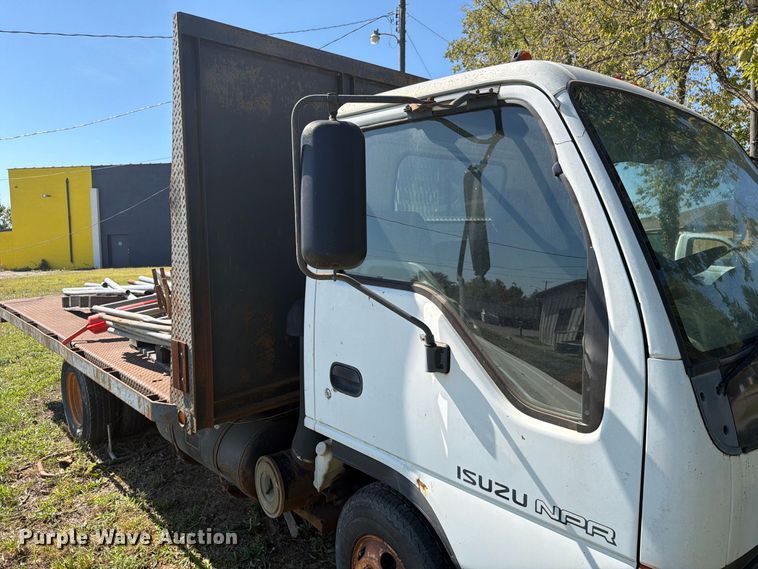 image for item FC3385 1999 Isuzu NPR flatbed truck