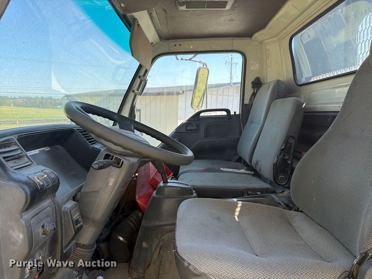 image for item FC3385 1999 Isuzu NPR flatbed truck