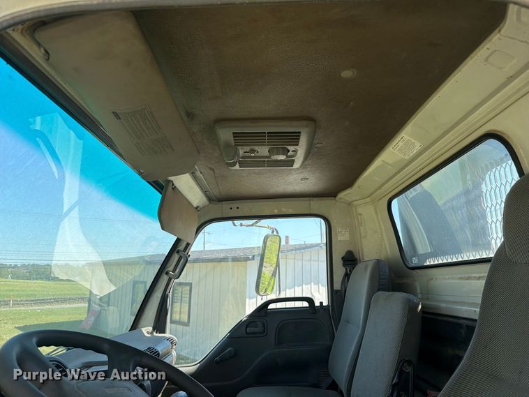 image for item FC3385 1999 Isuzu NPR flatbed truck