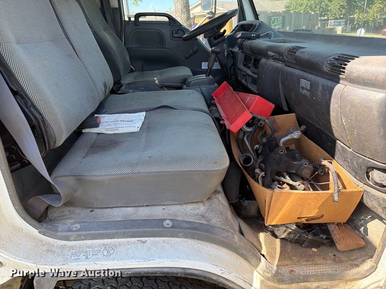image for item FC3385 1999 Isuzu NPR flatbed truck