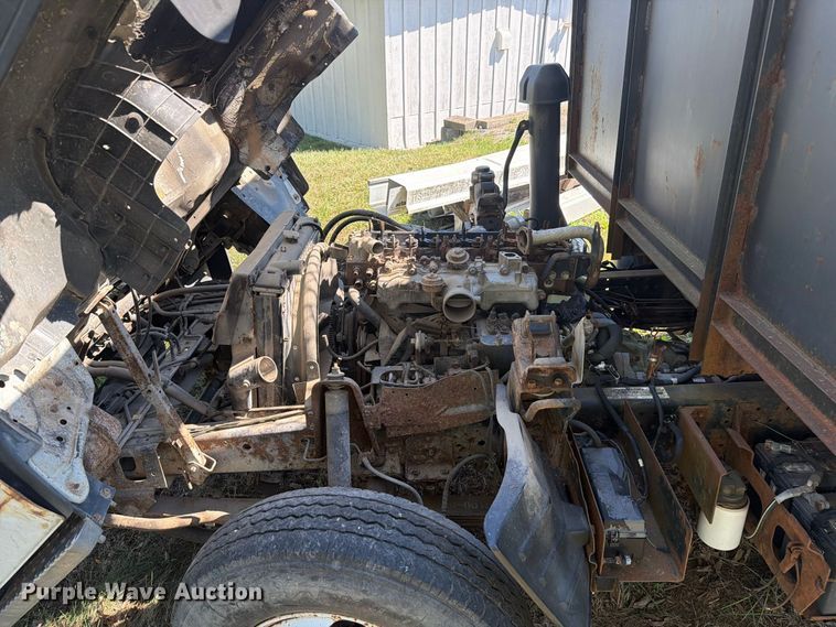 image for item FC3385 1999 Isuzu NPR flatbed truck