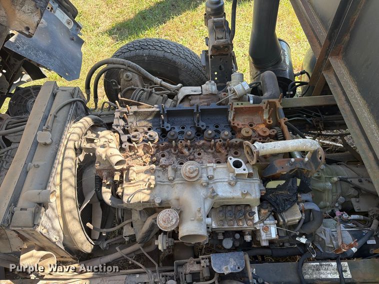 image for item FC3385 1999 Isuzu NPR flatbed truck