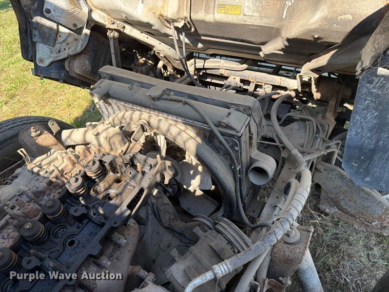 image for item FC3385 1999 Isuzu NPR flatbed truck