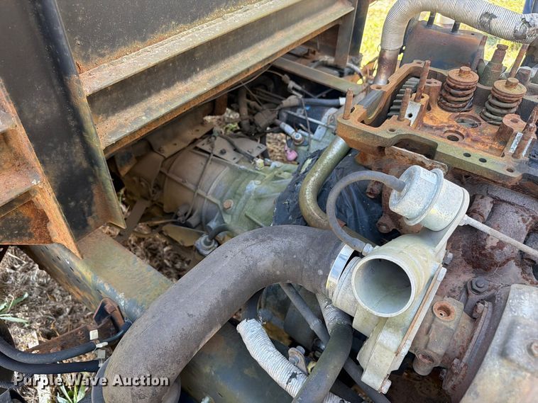 image for item FC3385 1999 Isuzu NPR flatbed truck