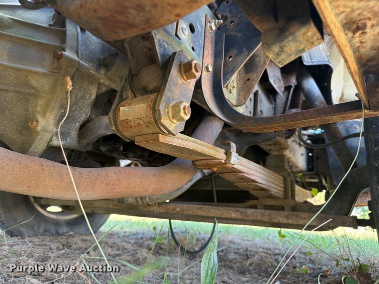 image for item FC3385 1999 Isuzu NPR flatbed truck