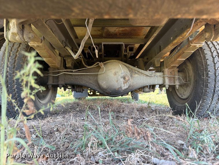 image for item FC3385 1999 Isuzu NPR flatbed truck