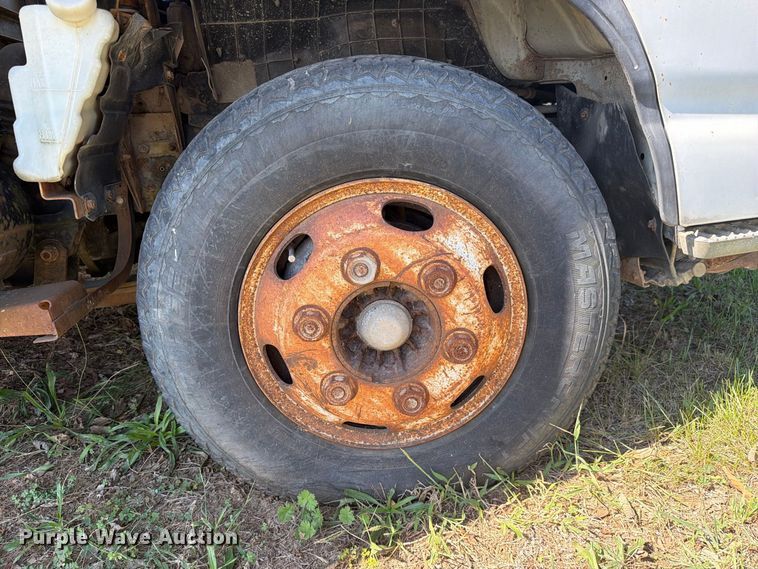 image for item FC3385 1999 Isuzu NPR flatbed truck