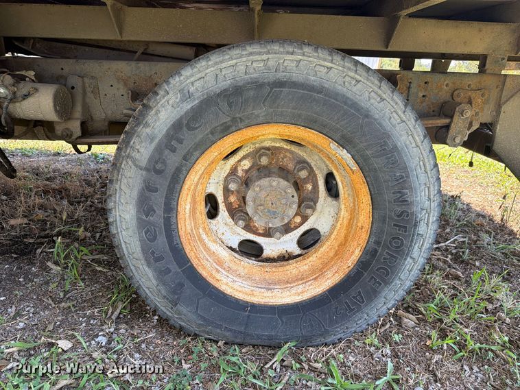 image for item FC3385 1999 Isuzu NPR flatbed truck
